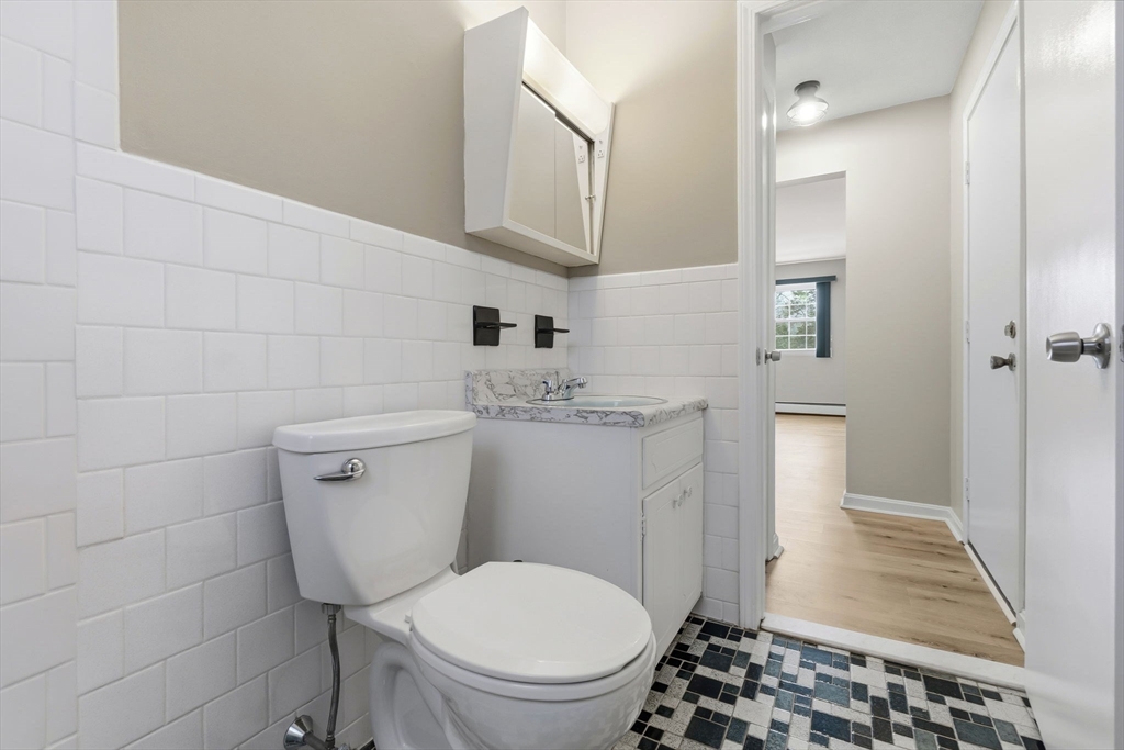 6 Venice Street, Unit B6 Danvers, MA 01923 - Photo 13 of 19 a bathroom with a toilet and a shower