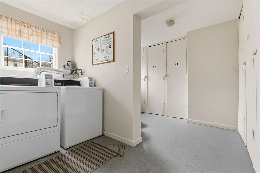 6 Venice Street, Unit B6 Danvers, MA 01923 - Photo 14 of 19 a view of a kitchen with fridge and workspace