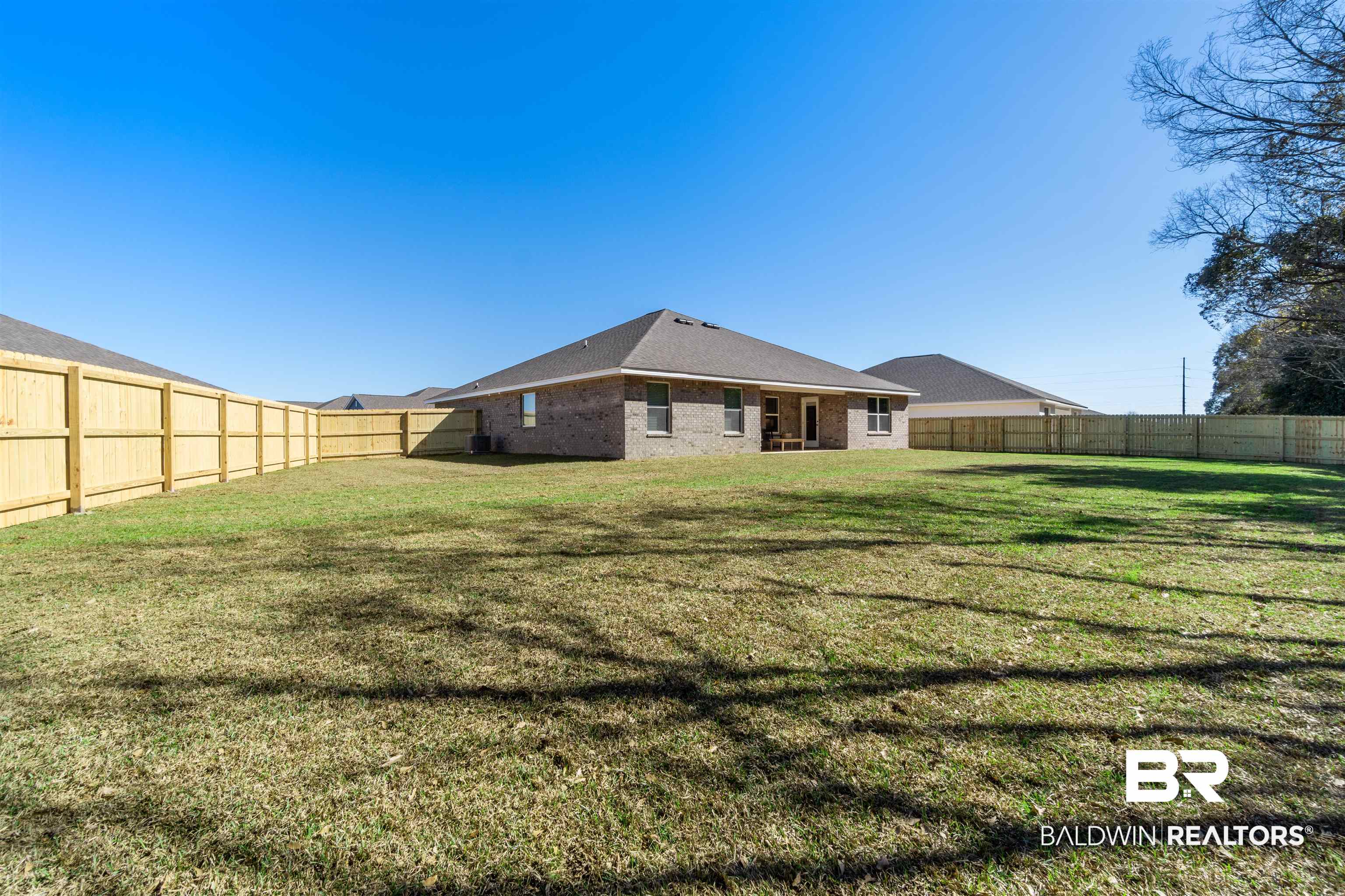 24472 Ringneck Loop Elberta, AL 36530 - Photo 42 of 46 Back of house featuring a lawn