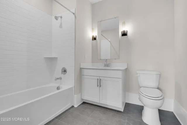 a bathroom with a toilet sink and bathtub