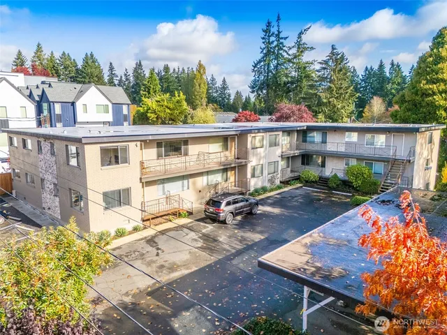 a view of a patio with couches table and chairs and potted plants