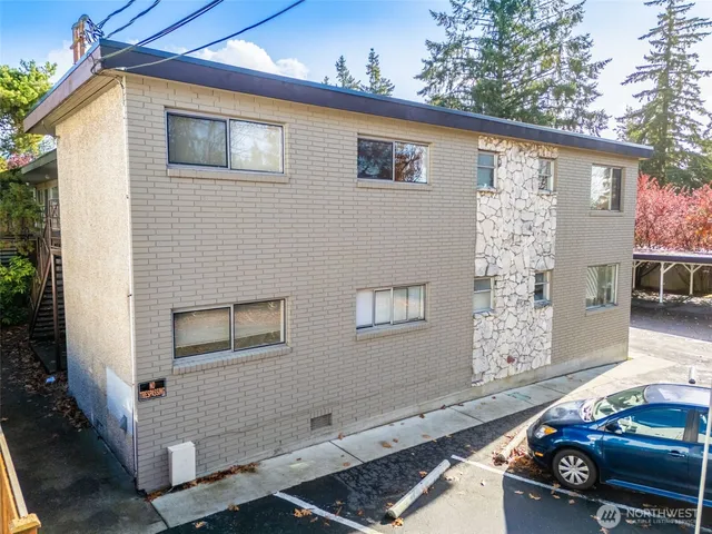 a front view of a house with parking