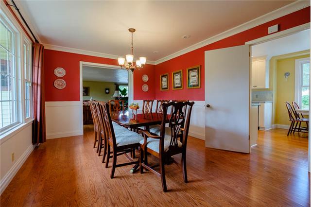 1425 Neelys Bend Road Madison, TN 37115 - Photo 14 of 20 Formal dining room with kitchen to the right and living room to the left.