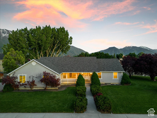1085 West 1050th Street North Mapleton, UT 84664 - Photo 1 of 1 Ranch-style home with a mountain view and a lawn