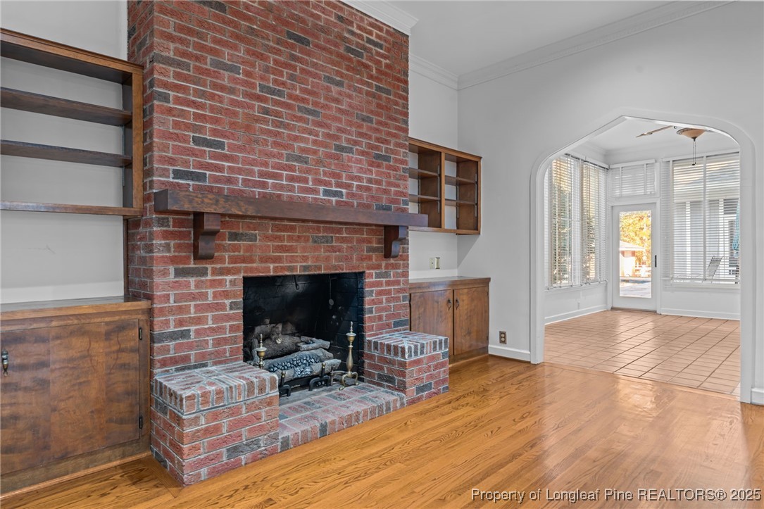 2000 Airport Road Whispering Pines, NC 28327 - Photo 38 of 50 a living room with furniture and a fireplace
