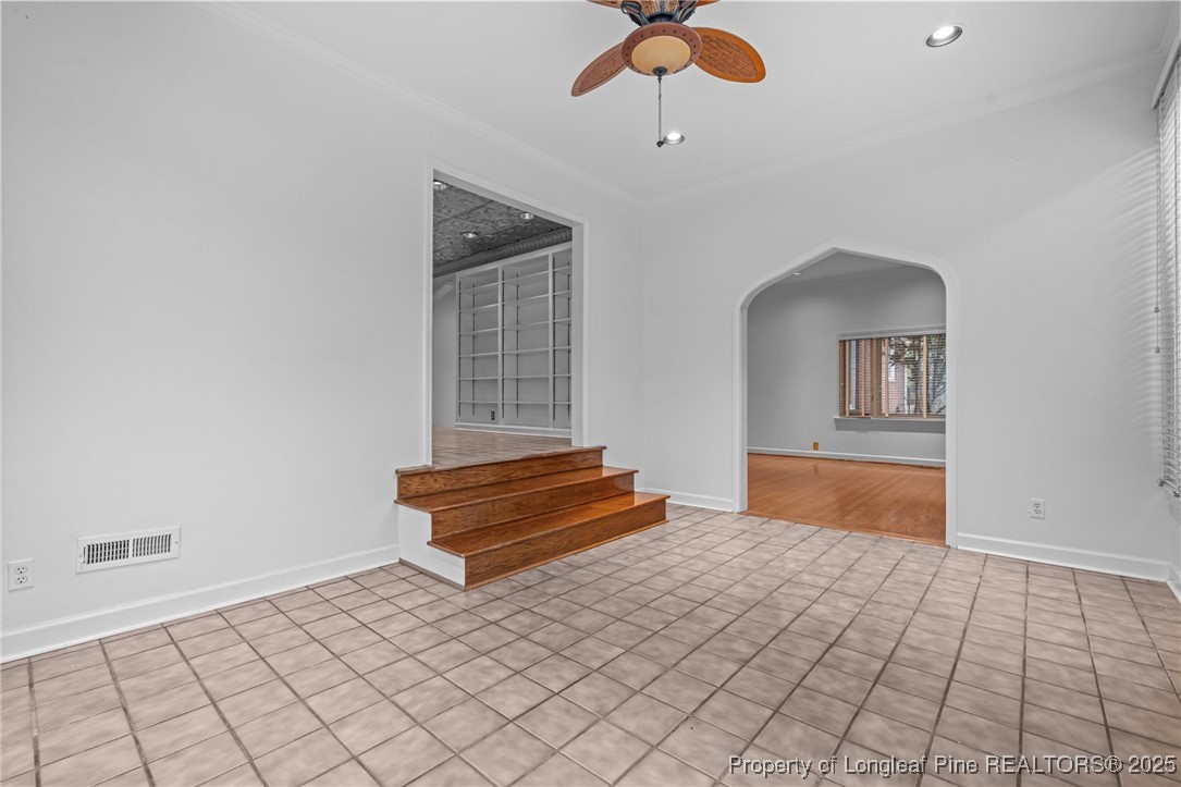 2000 Airport Road Whispering Pines, NC 28327 - Photo 40 of 50 a bedroom with a bed and a chandelier