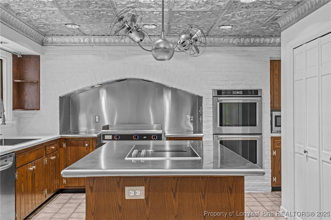 2000 Airport Road Whispering Pines, NC 28327 - Photo 42 of 50 a kitchen with a stove and a sink