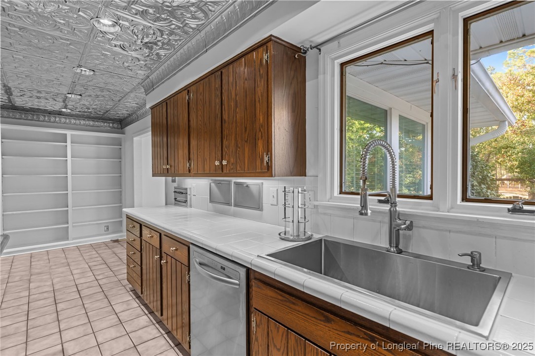 2000 Airport Road Whispering Pines, NC 28327 - Photo 49 of 50 a kitchen with a sink and a window