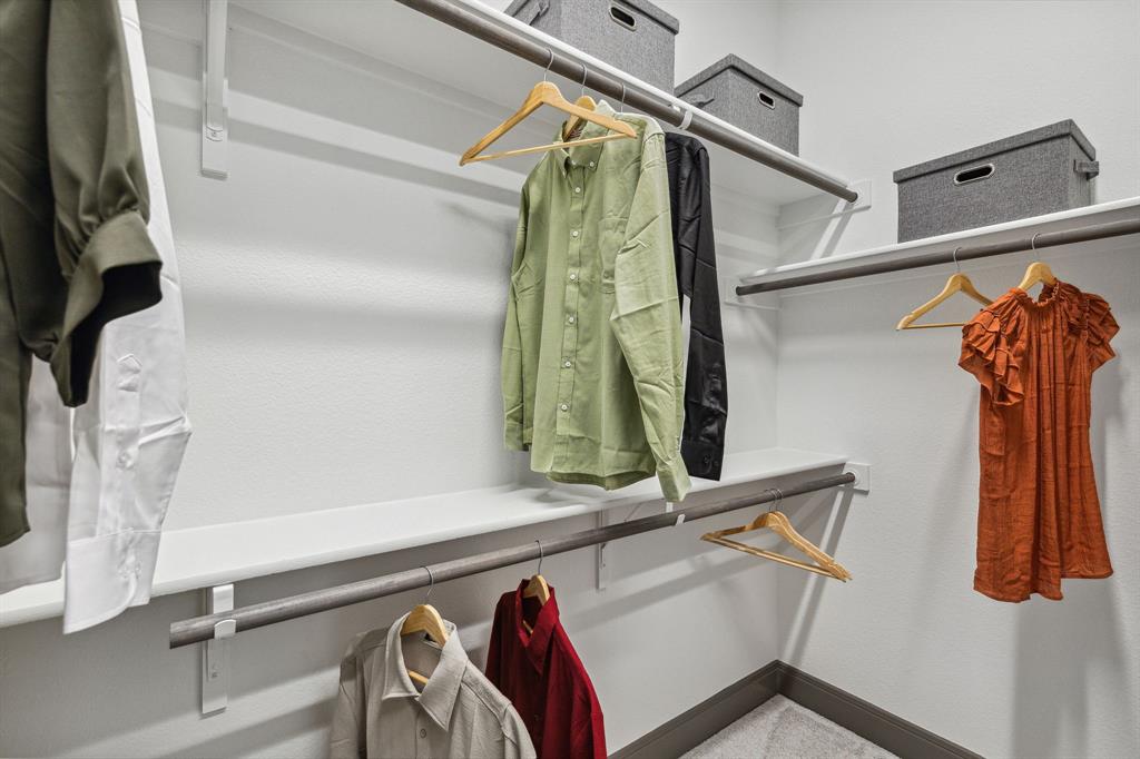 2078 Cuellar Way Van Alstyne, TX 75495 - Photo 16 of 30 a view of walk in closet with clothes and shoes