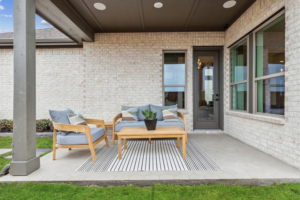 2078 Cuellar Way Van Alstyne, TX 75495 - Photo 2 of 30 a view of a patio with table and chairs and potted plants