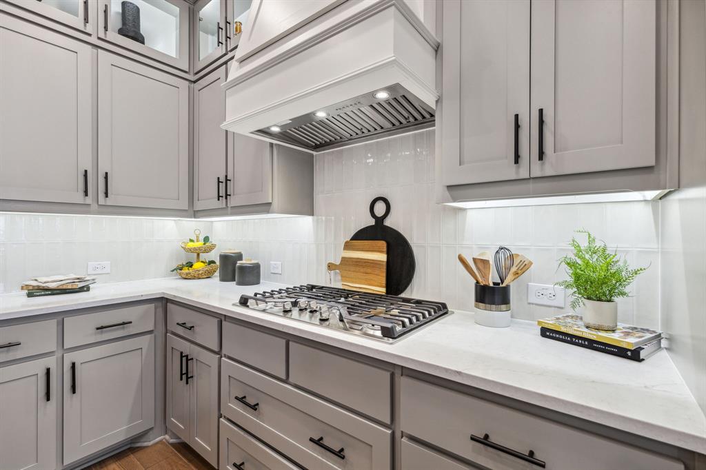 2078 Cuellar Way Van Alstyne, TX 75495 - Photo 21 of 30 a kitchen with stainless steel appliances kitchen island granite countertop a sink a stove and cabinets