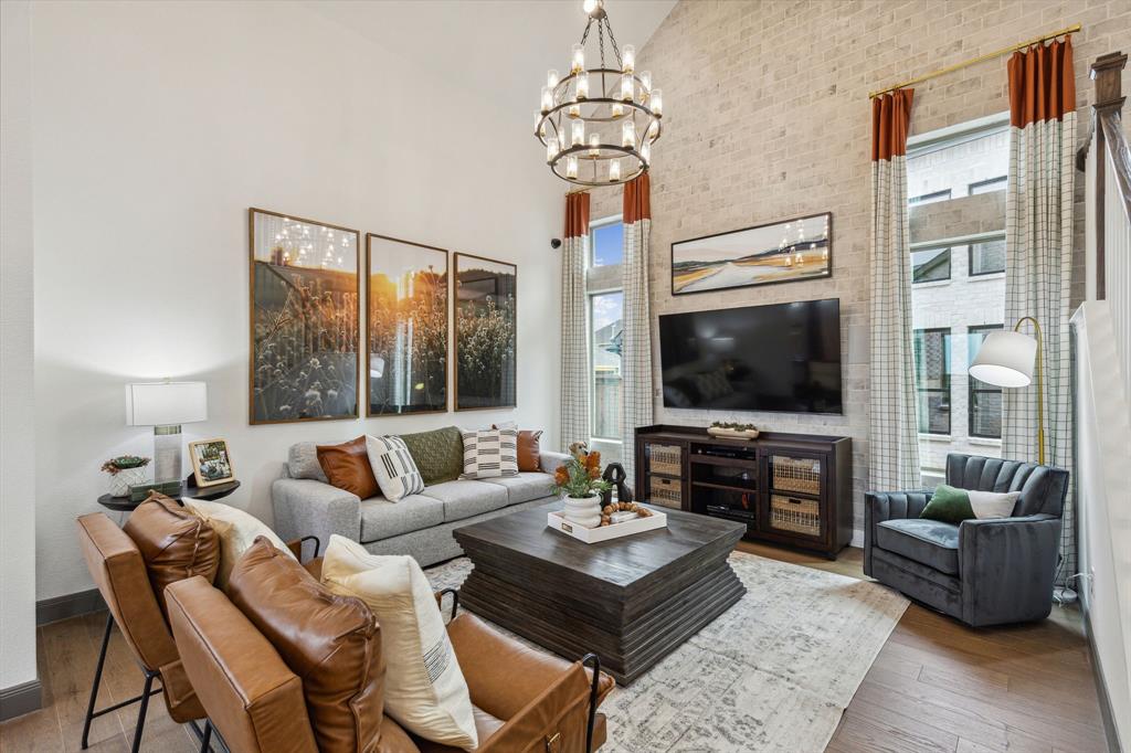 2078 Cuellar Way Van Alstyne, TX 75495 - Photo 24 of 30 a living room with furniture a flat screen tv and a large window