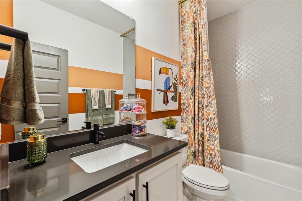 2078 Cuellar Way Van Alstyne, TX 75495 - Photo 30 of 30 a bathroom with a granite countertop sink toilet and shower