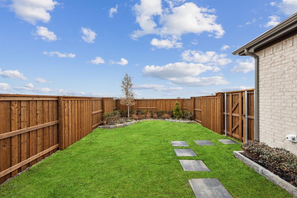 2078 Cuellar Way Van Alstyne, TX 75495 - Photo 3 of 30 a view of a backyard with wooden fence