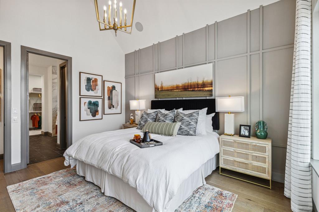 2078 Cuellar Way Van Alstyne, TX 75495 - Photo 10 of 30 a bedroom with a large bed and a chandelier