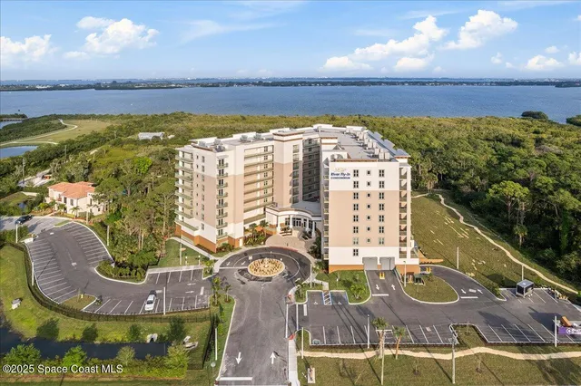 a view of swimming pool with outdoor seating space and living room view