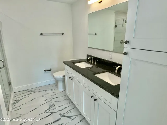 a bathroom with a shower and bathtub