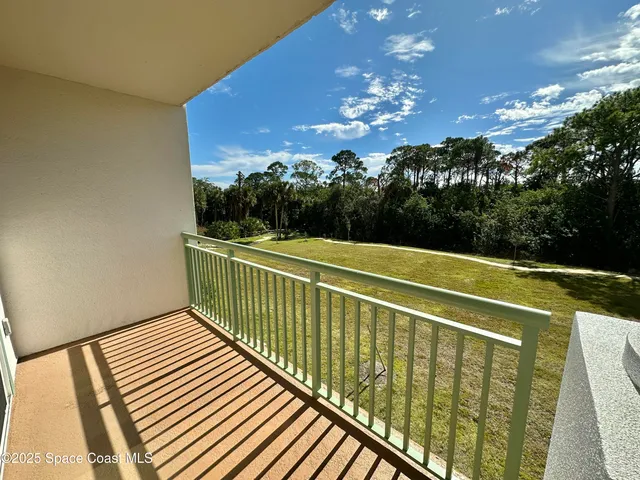 a view of a room with a large window