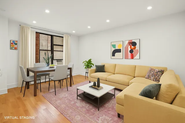 a living room with furniture and a table