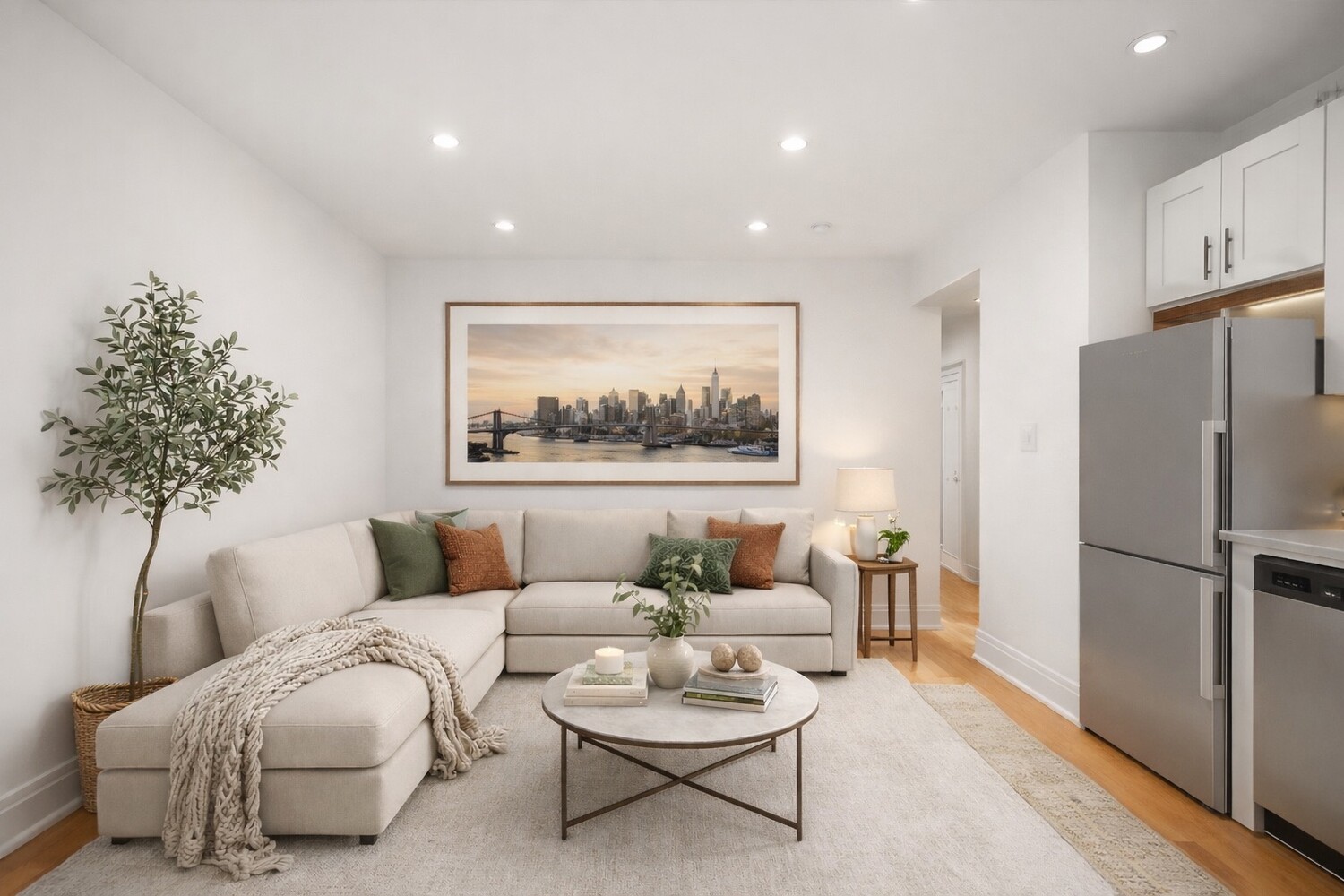 a living room with furniture and a potted plant