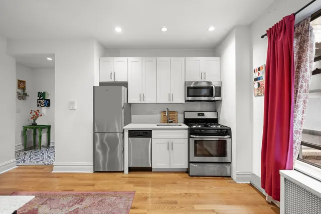 a kitchen with stainless steel appliances granite countertop a refrigerator stove and oven
