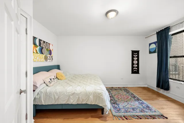 a bedroom with a bed and window