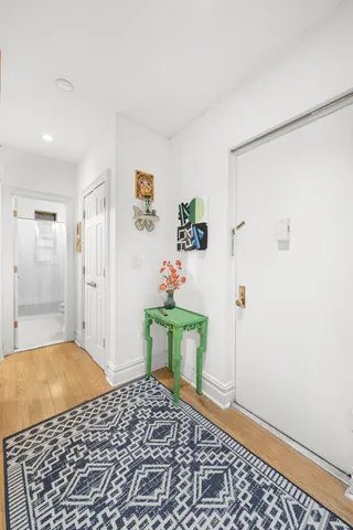 a bedroom with a bed and a table