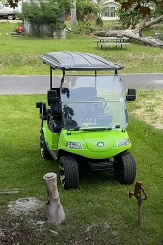 a view of a swimming pool with a yard