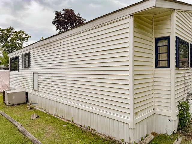 a view of a house with a backyard and a window