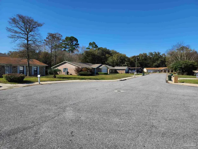 a view of swimming pool with outdoor seating and city view