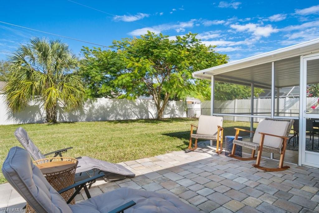 1207 Hernando Street Naples, FL 34103 - Photo 32 of 37 a view of a swimming pool with chairs in patio