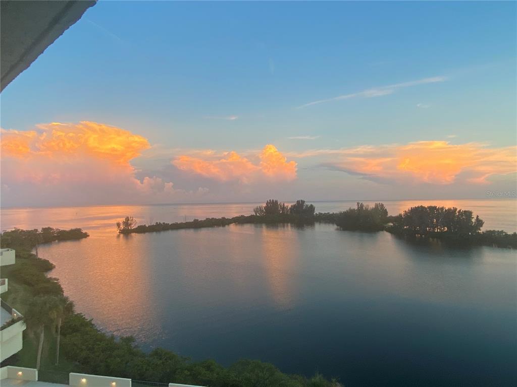 6035 Sea Ranch Drive, Unit 901 Hudson, FL 34667 - Photo 71 of 72 a view of a lake with houses in the back