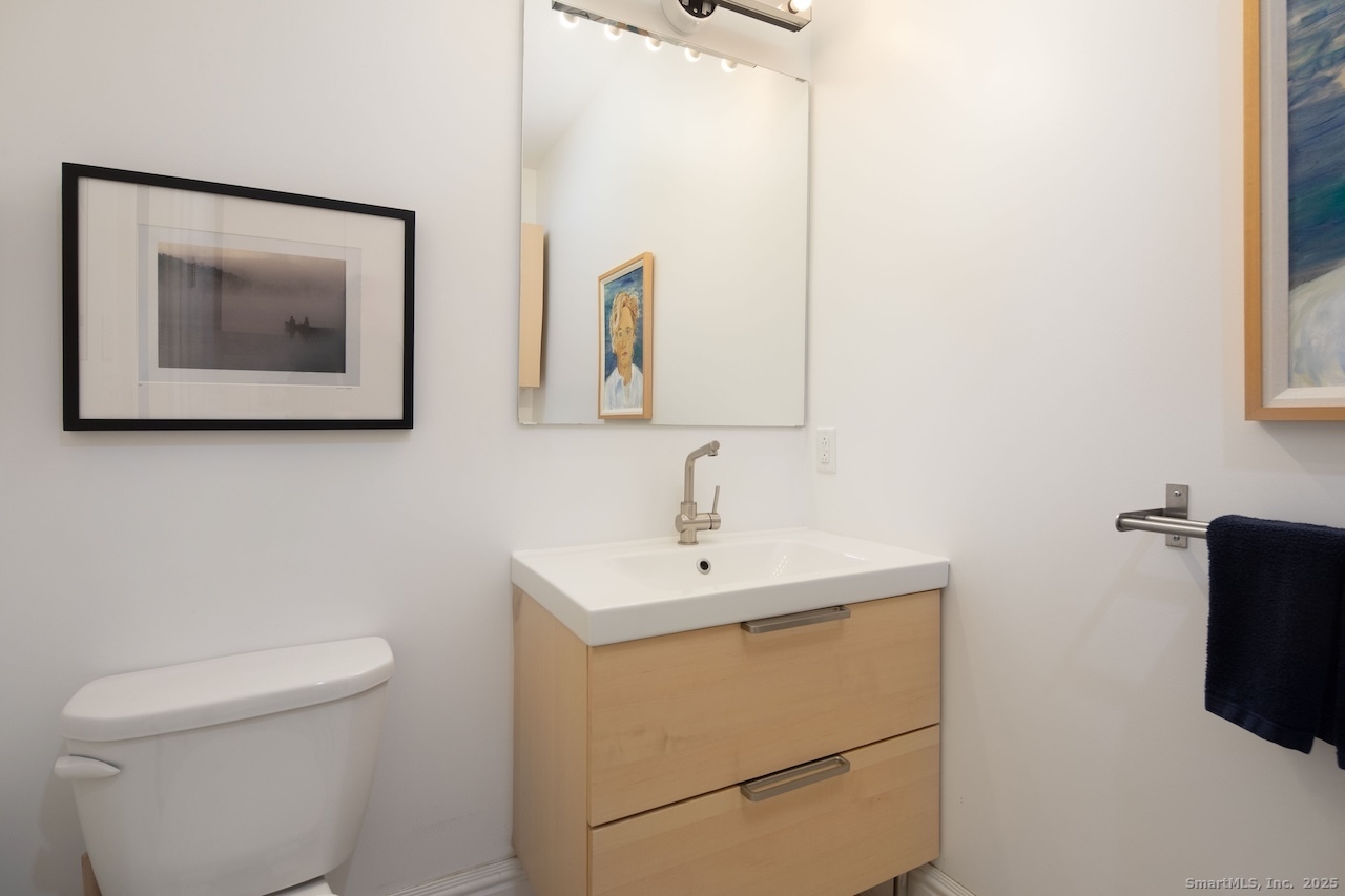 31 Sharon Road, Unit 4 Salisbury, CT 06039 - Photo 11 of 16 a bathroom with a toilet sink and mirror