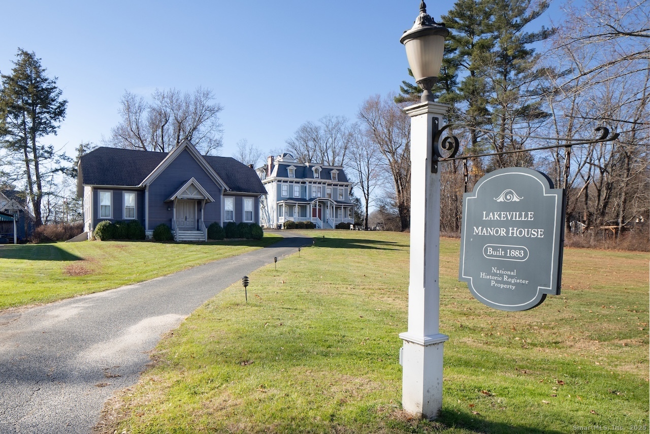 31 Sharon Road, Unit 4 Salisbury, CT 06039 - Photo 16 of 16 a front view of a house with a yard