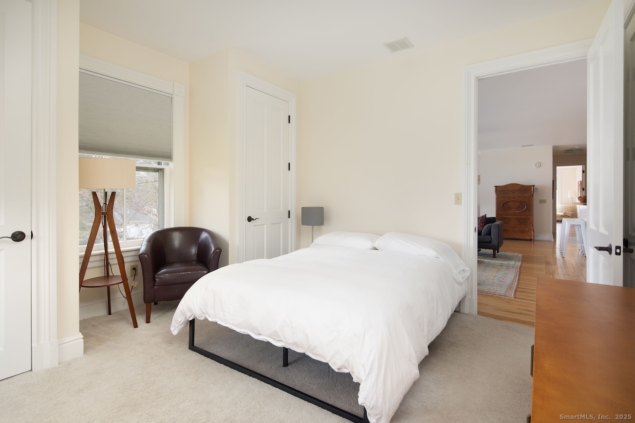 31 Sharon Road, Unit 4 Salisbury, CT 06039 - Photo 6 of 16 a bedroom with double bed and a large mirror