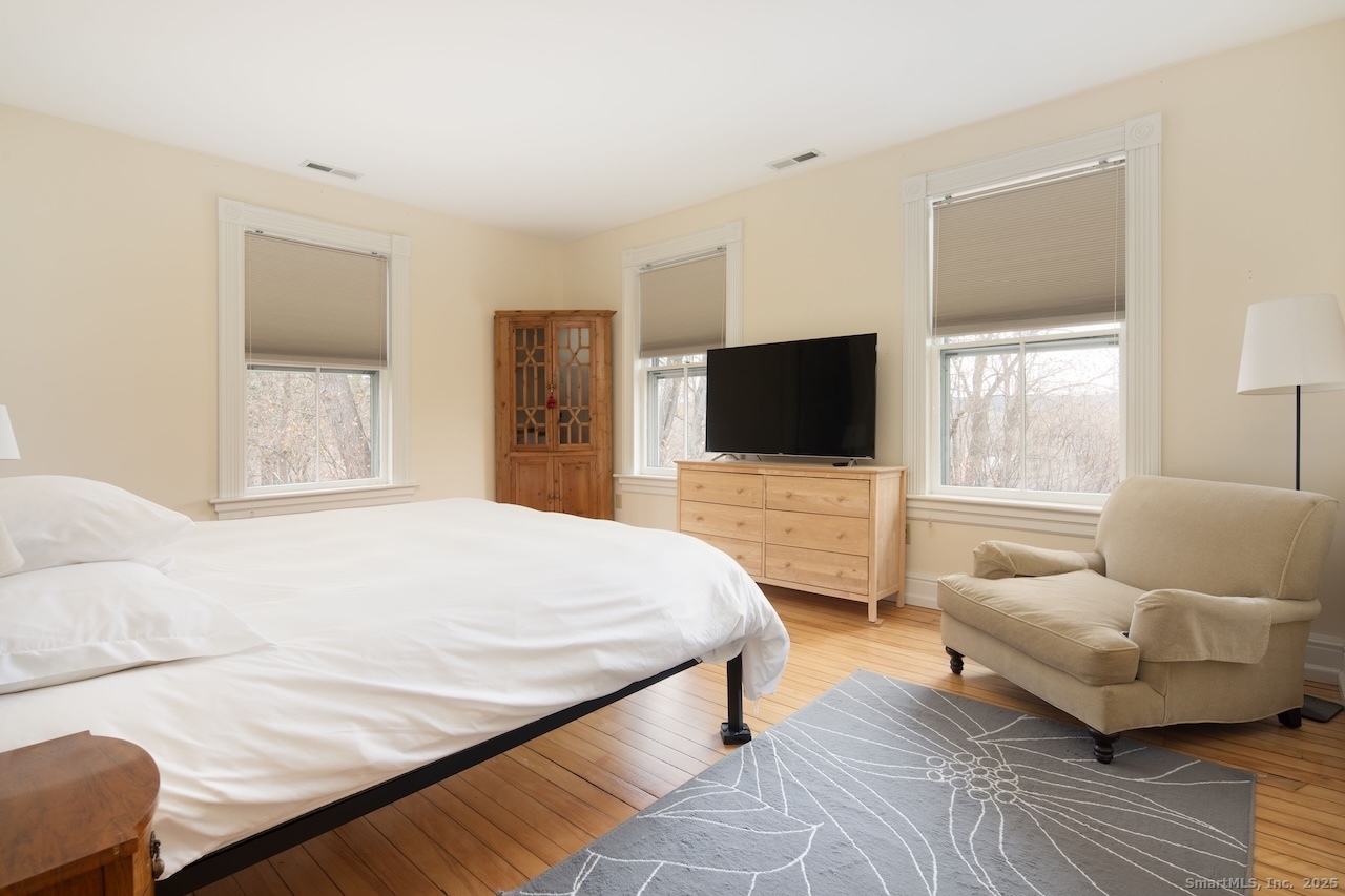 31 Sharon Road, Unit 4 Salisbury, CT 06039 - Photo 9 of 16 a bedroom with a bed and a flat screen tv