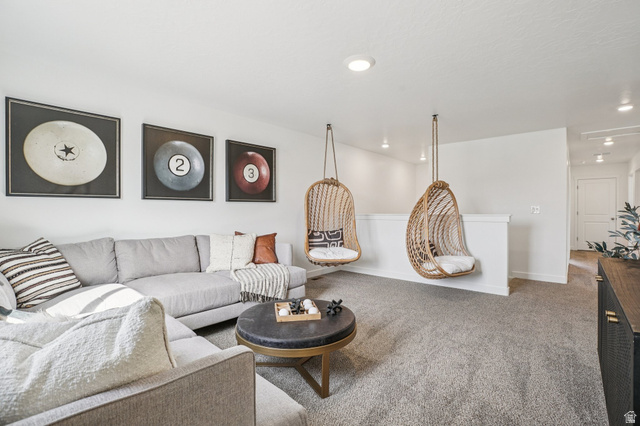 2097 North Ostler Peak Road, Unit 115 Heber City, UT 84032 - Photo 33 of 33 Spacious bonus room featuring plush carpeting, recessed lighting, white walls, and a half-wall partition