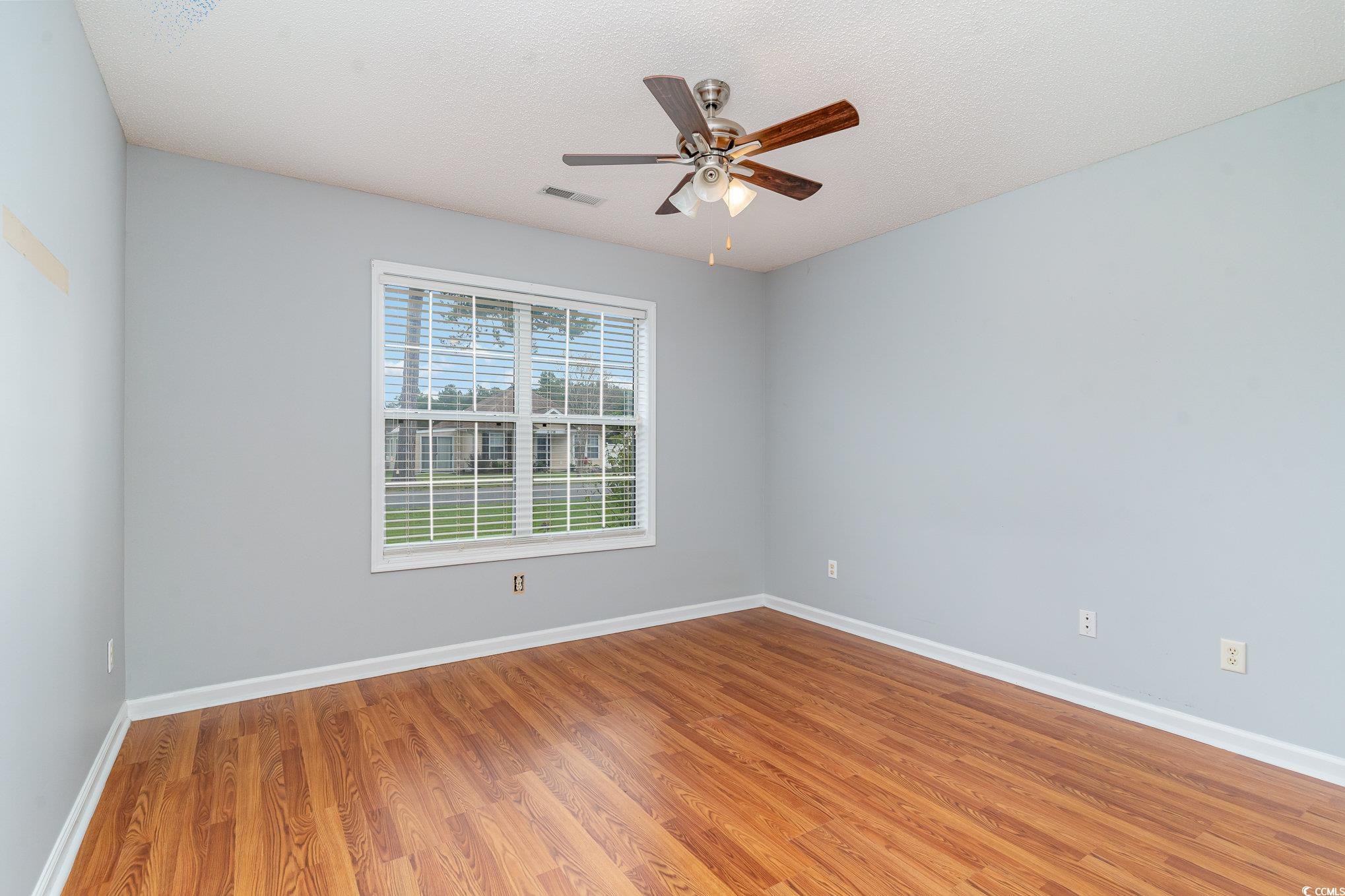 209 Kestrel Court Myrtle Beach, SC 29588 - Photo 13 of 27 Empty room featuring light hardwood / wood-style f