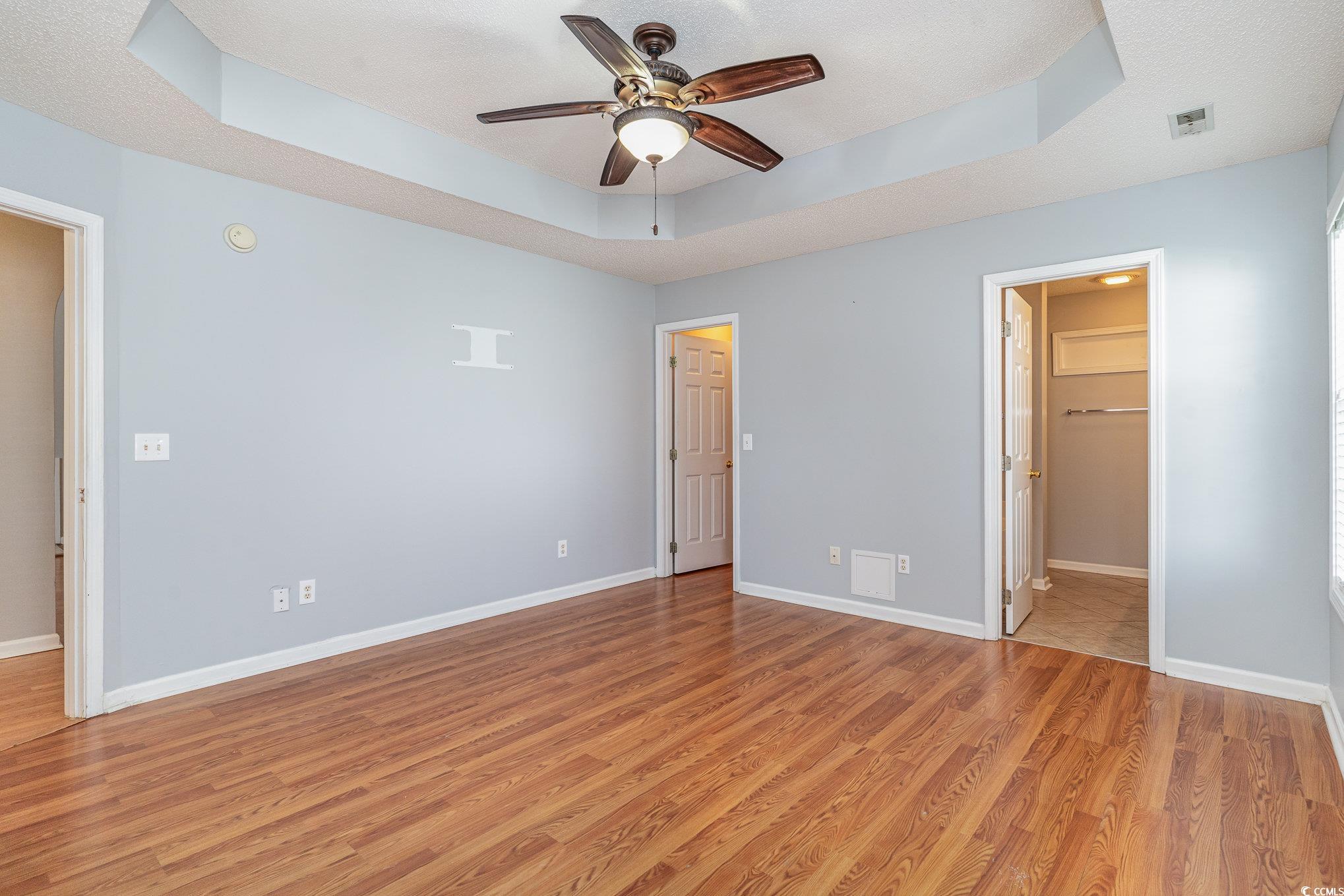 209 Kestrel Court Myrtle Beach, SC 29588 - Photo 20 of 27 Unfurnished bedroom with ceiling fan, a textured c