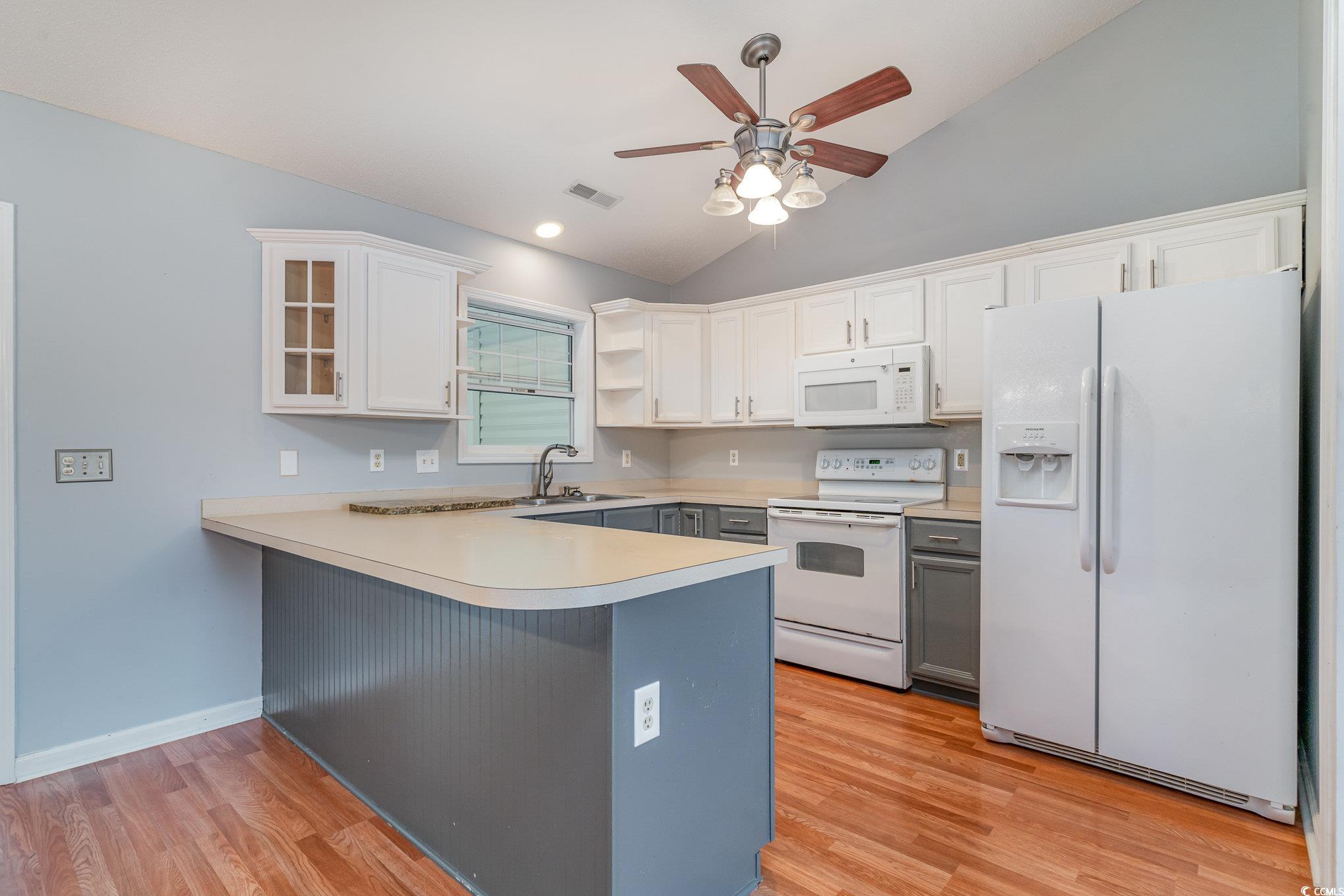 209 Kestrel Court Myrtle Beach, SC 29588 - Photo 8 of 27 Kitchen with white cabinetry, white appliances, ki