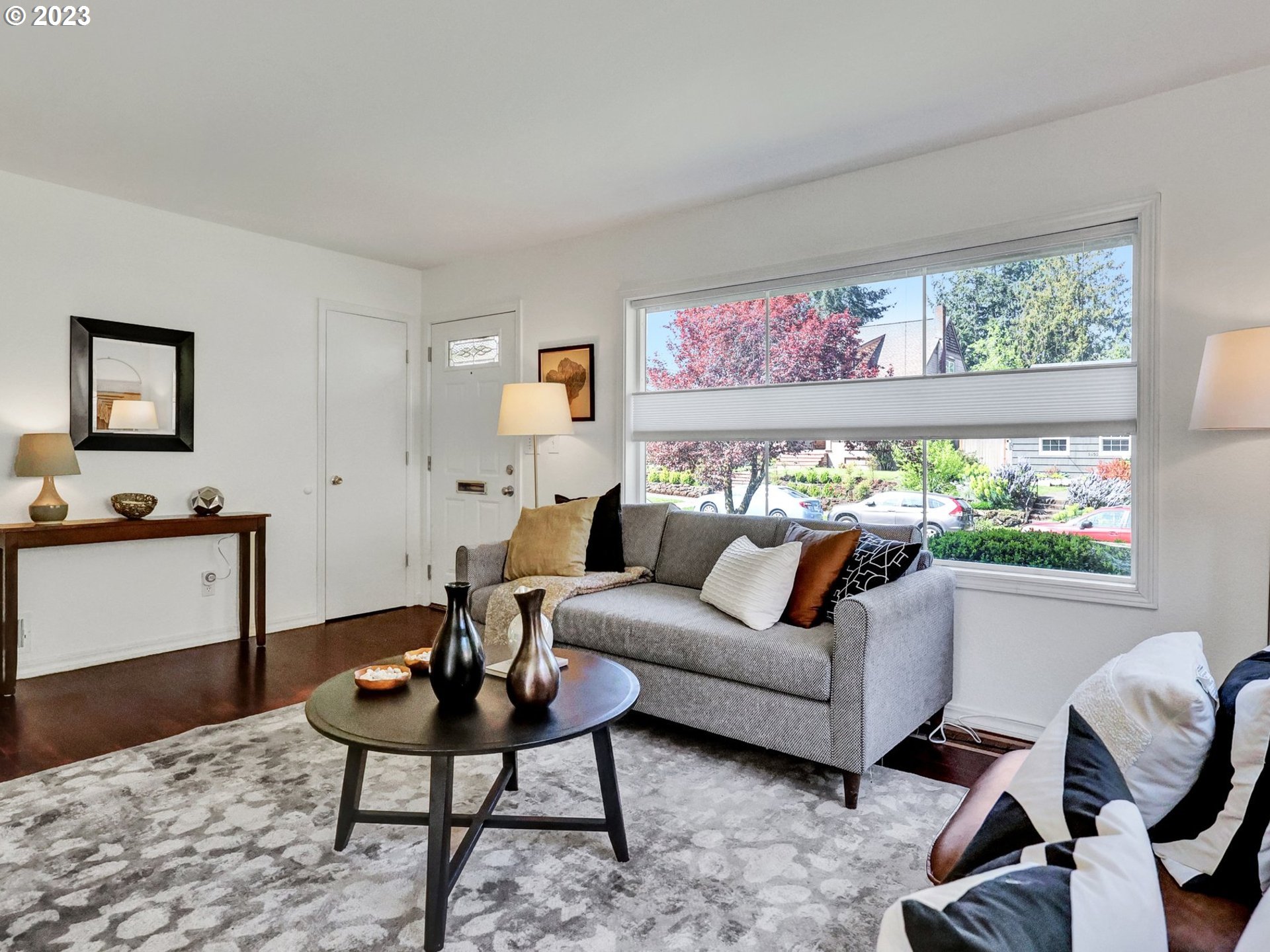 5606 Northeast 27th Avenue Portland, OR 97211 - Photo 5 of 48 a living room with furniture and a potted plant