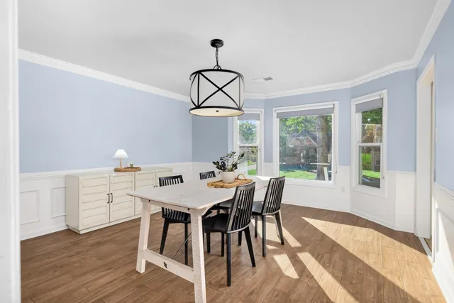 a view of a dining room with furniture window and outside view