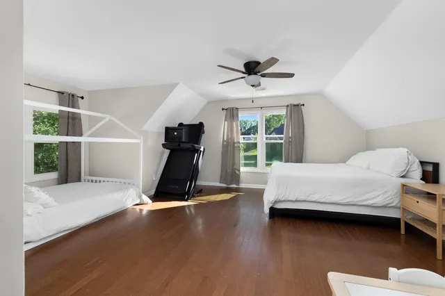 a room with a bed and a window