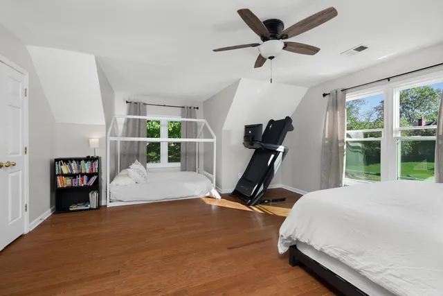 a bed room with a bed and a window