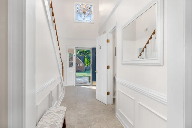 a view of entryway with window and hallway