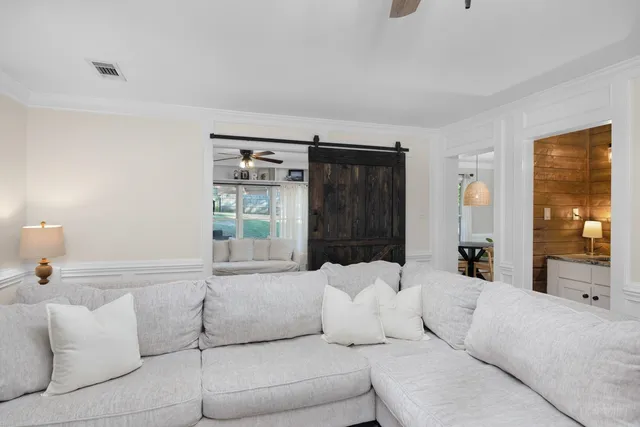 a living room with furniture and a window