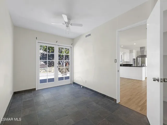 a view of a street with a houses in the background