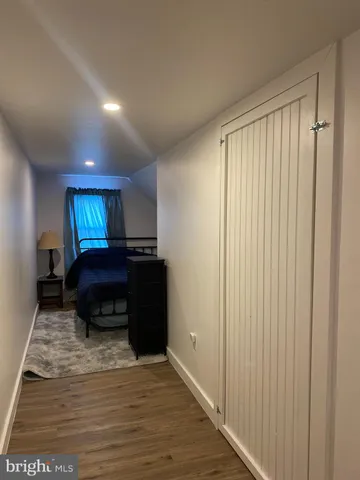 a living room with furniture and a lamp