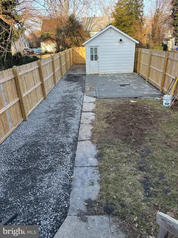 a view of a backyard of the house