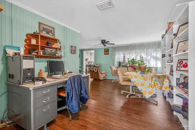 a view of a workspace with furniture and toys